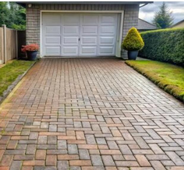Paver driveway after pressure washing, clean and evenly toned