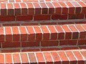 Brick porch treads after washing, mortar lines clean and the brick evenly toned