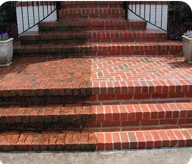 Brick front steps in Franklin part way through the clean, showing the line between dirty and washed brick